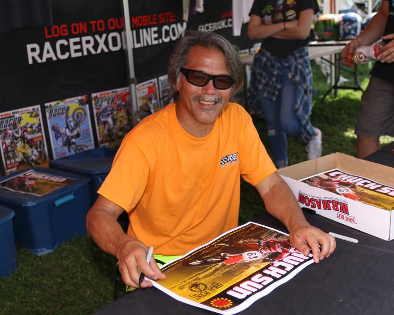 Chuck Sun signing autographs and bench racing at the Racer X booth last year.